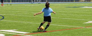 soccer ball being pushed around by kids